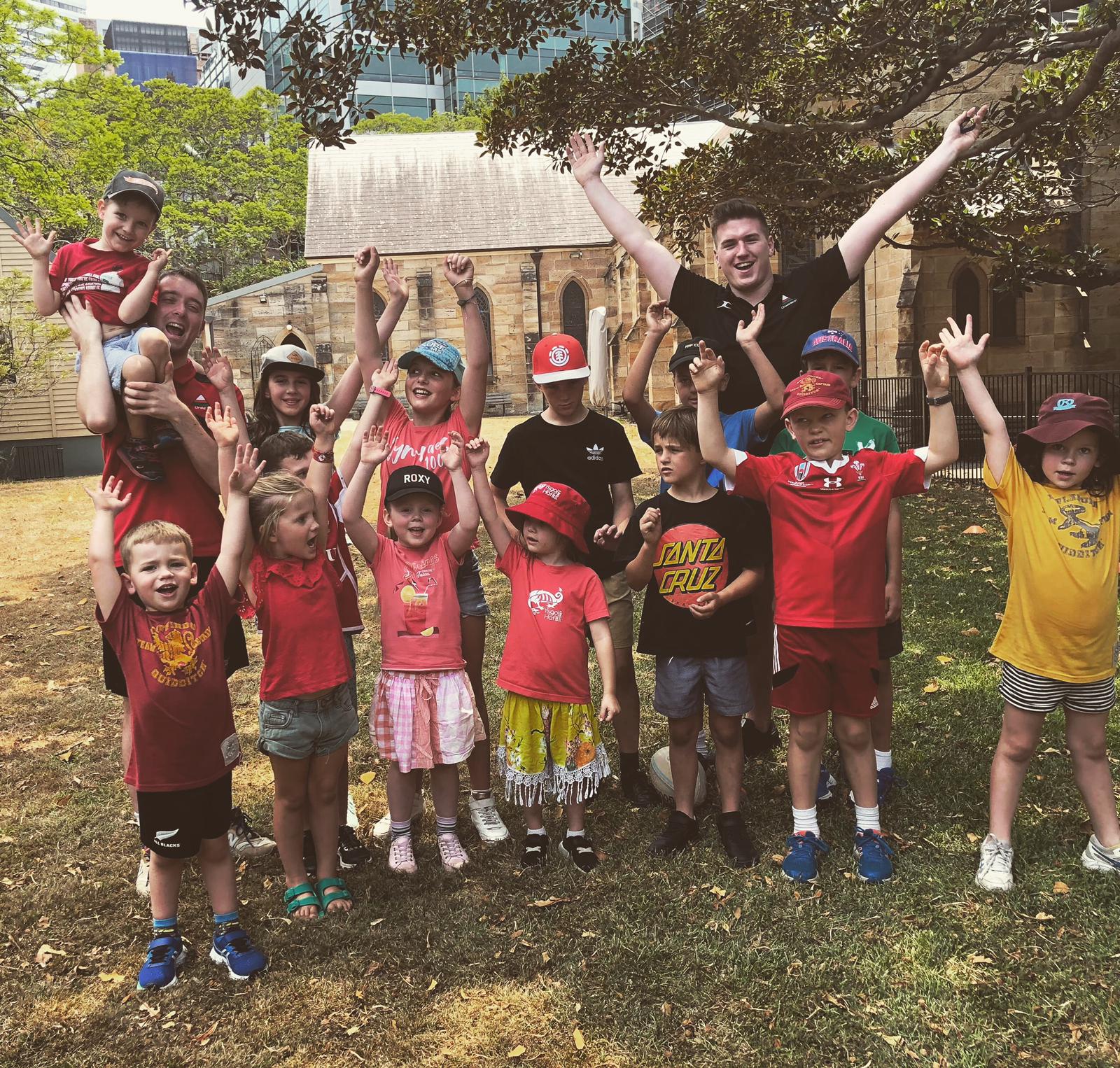 Some of the children at Sydney's Welsh Summer School enjoying Welsh medium activities with Lewys and Jack